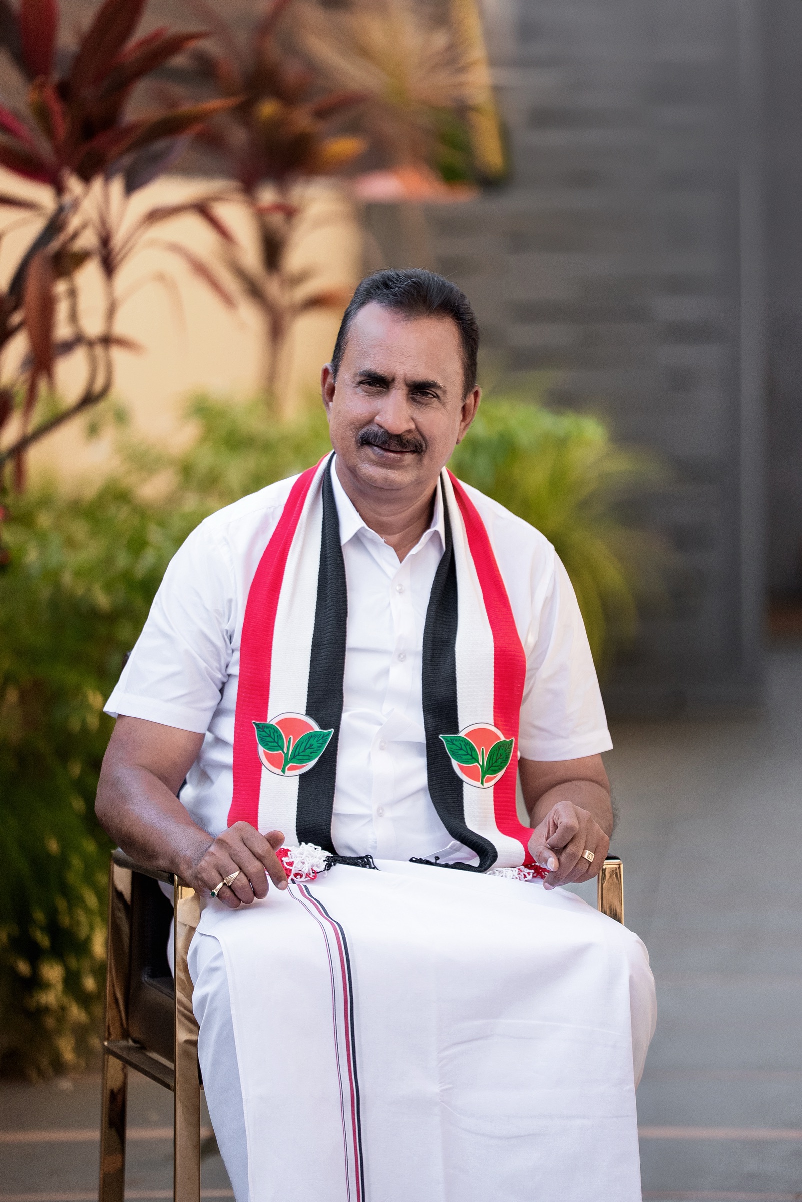 S. P. Velumani seated