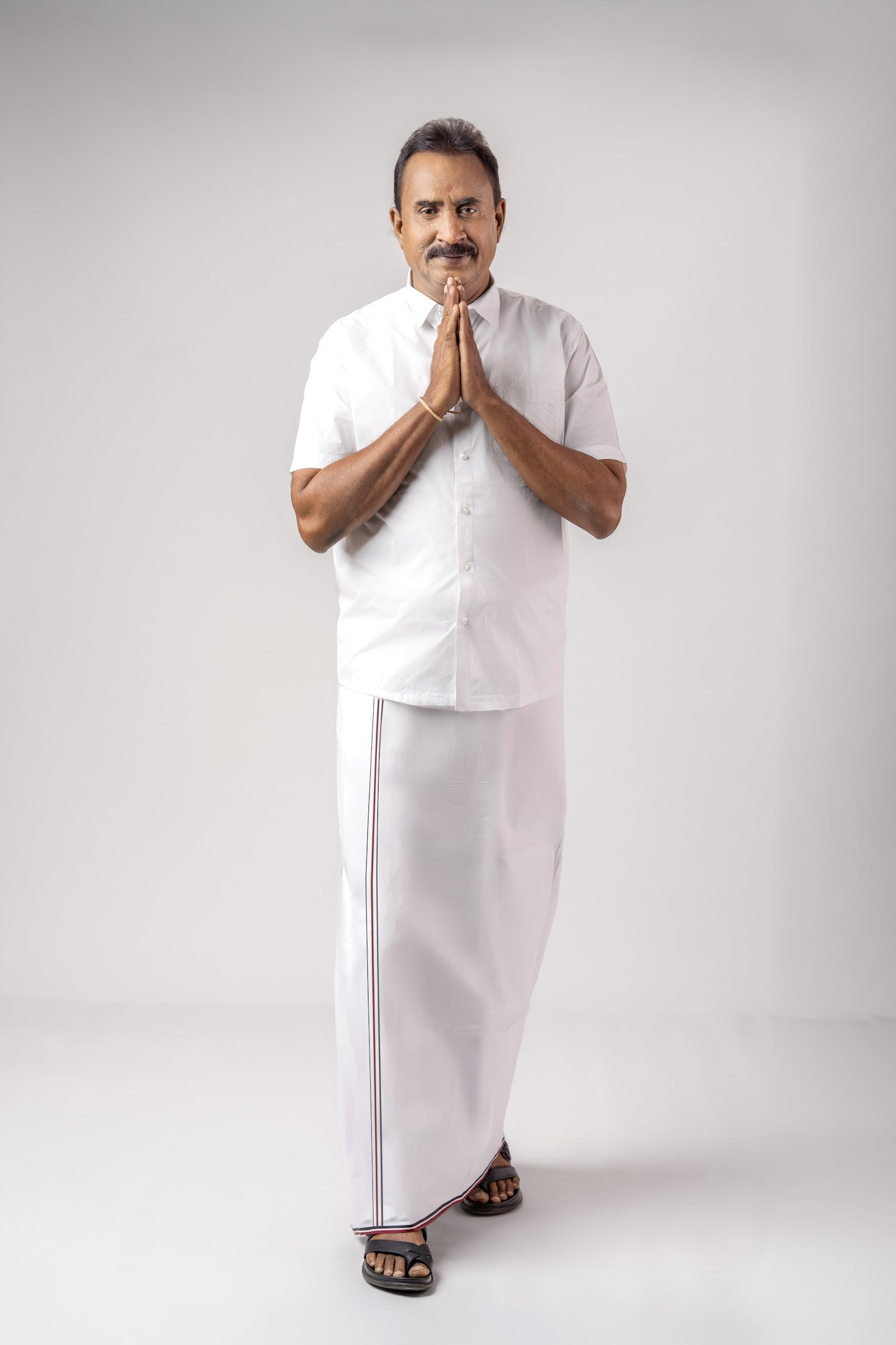 S. P. Velumani greeting with folded hands