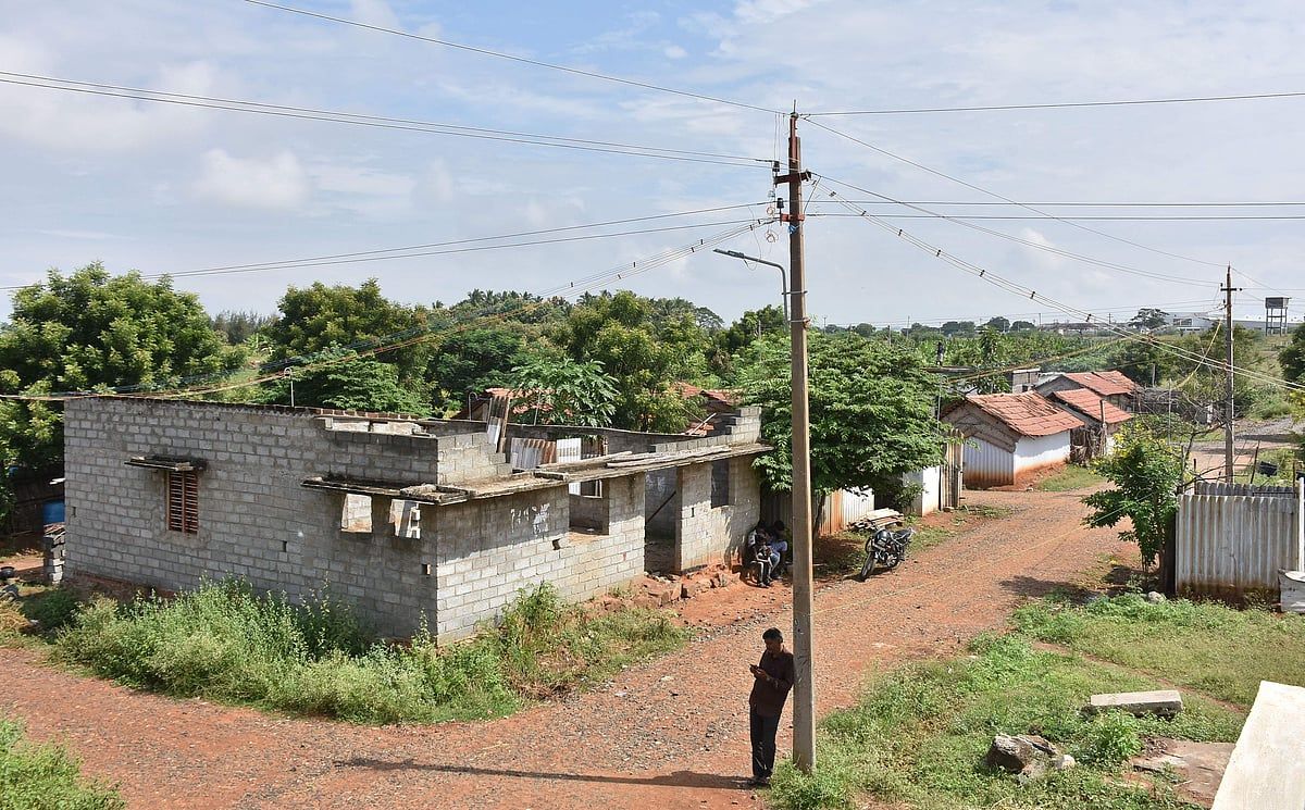 Houses and electricity poles along a village road