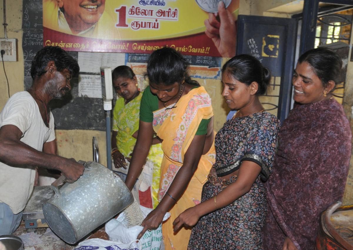 Families collecting provisions at a ration shop