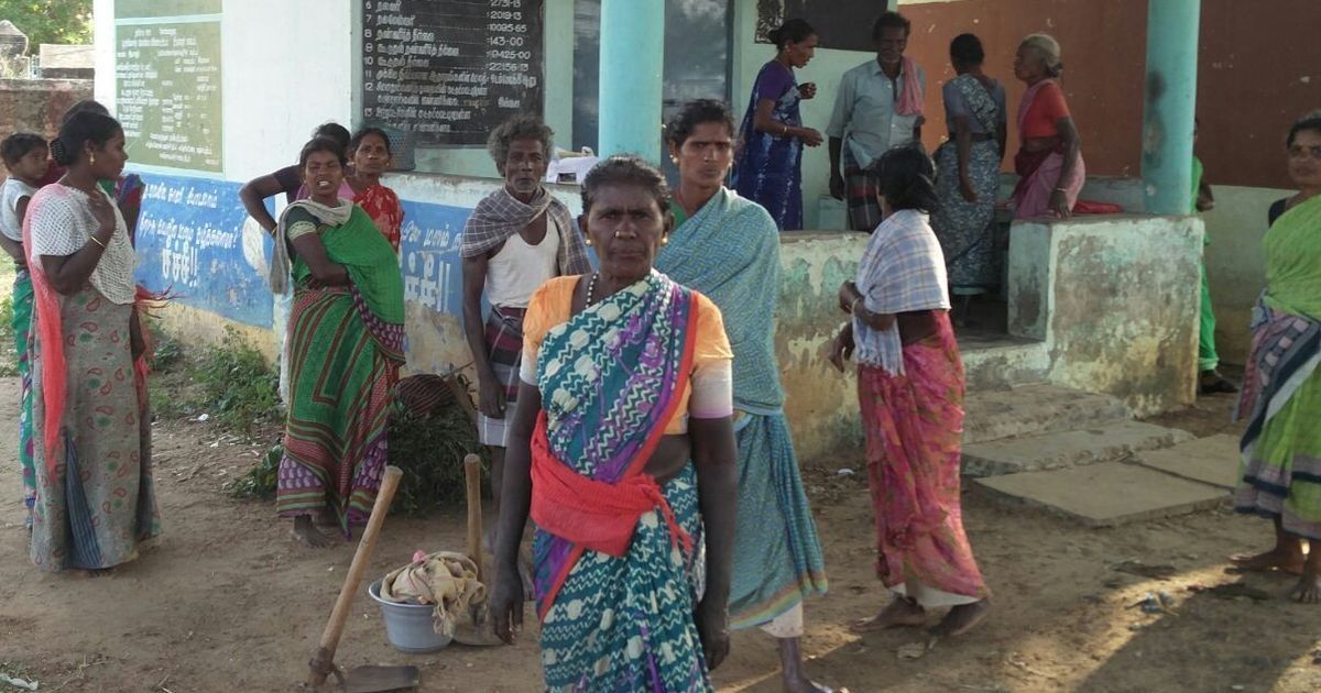 Women gathered outside a village office