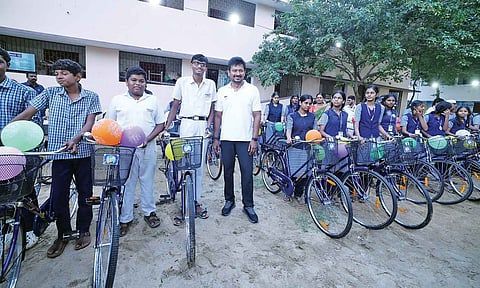 Schoolchildren with the free bicycles they received